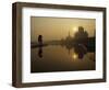 Stray Dog on a Sand Bank of the Yamuna River as the Sun is Seen Rising over the Taj Mahal in India-null-Framed Photographic Print