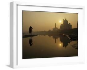 Stray Dog on a Sand Bank of the Yamuna River as the Sun is Seen Rising over the Taj Mahal in India-null-Framed Photographic Print