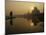 Stray Dog on a Sand Bank of the Yamuna River as the Sun is Seen Rising over the Taj Mahal in India-null-Mounted Photographic Print
