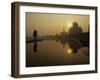 Stray Dog on a Sand Bank of the Yamuna River as the Sun is Seen Rising over the Taj Mahal in India-null-Framed Photographic Print