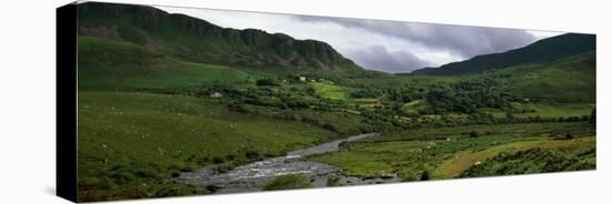 Stream Through Lush Mountain Landscape, Distant Cottages, Ireland-null-Stretched Canvas