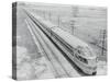 Streamlined Train Cars on Daytime Schedule-null-Stretched Canvas