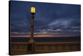 Street lamp against dramatic sky at dusk, Seaside, Oregon, USA-Panoramic Images-Stretched Canvas