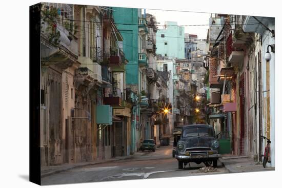 Street Scene before Sunrise - Dilapidated Buildings Crowded Together and Vintage American Cars-Lee Frost-Stretched Canvas
