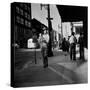 Street Scene with Village Atmosphere, Man Carrying Baby-Walker Evans-Stretched Canvas