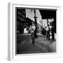 Street Scene with Village Atmosphere, Man Carrying Baby-Walker Evans-Framed Photographic Print