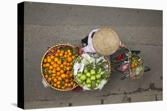 Street vendor with baskets of fruit on bicycle, Old Quarter, Hanoi, Vietnam-David Wall-Stretched Canvas