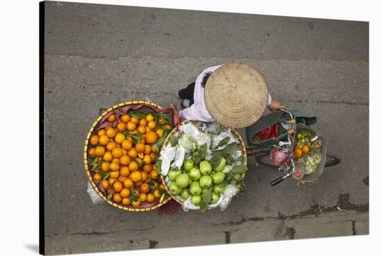 Street vendor with baskets of fruit on bicycle, Old Quarter, Hanoi, Vietnam-David Wall-Stretched Canvas