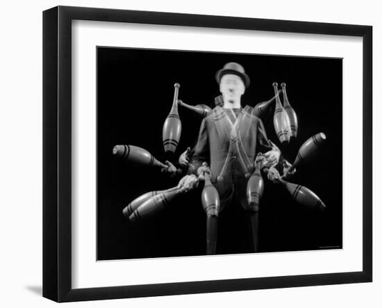 Stroboscopic Image of Juggler Stan Cavenaugh Juggling Tenpins-Gjon Mili-Framed Photographic Print