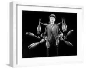 Stroboscopic Image of Juggler Stan Cavenaugh Juggling Tenpins-Gjon Mili-Framed Photographic Print