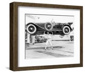 Strong Man Lifting A Car Over His Head-null-Framed Art Print