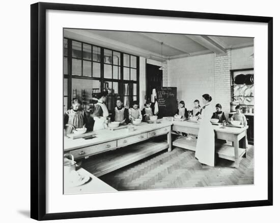 Student Teacher in a Cookery Lesson, Battersea Polytechnic, London, 1907-null-Framed Photographic Print