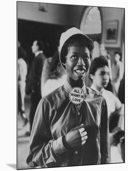 Student Wearing Hat and Button on Shirt That Says: All I Want is Love on "Old Clothes Day"-Gordon Parks-Mounted Photographic Print