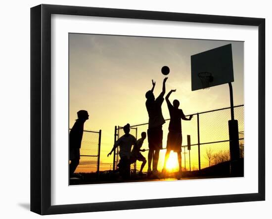 Students Play a Basketball Game as the Sun Sets at Bucks County Community College-null-Framed Premium Photographic Print