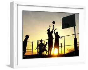 Students Play a Basketball Game as the Sun Sets at Bucks County Community College-null-Framed Premium Photographic Print