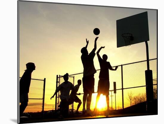 Students Play a Basketball Game as the Sun Sets at Bucks County Community College-null-Mounted Premium Photographic Print
