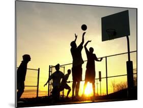 Students Play a Basketball Game as the Sun Sets at Bucks County Community College-null-Mounted Premium Photographic Print