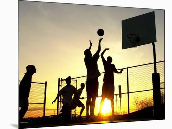 Students Play a Basketball Game as the Sun Sets at Bucks County Community College-null-Mounted Photographic Print
