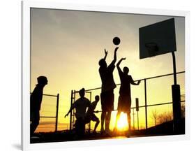 Students Play a Basketball Game as the Sun Sets at Bucks County Community College-null-Framed Photographic Print