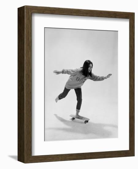 Studio Photos of Gloria Steinem Riding a Skateboard with a 007 James Bond Sweatshirt, 1965-Yale Joel-Framed Photographic Print