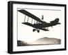 Stunt Woman Standing on Top of Biplane-null-Framed Photo