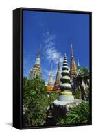 Stupas at the Temple of the Reclining Buddha, Bangkok, Thailand-Robert Francis-Framed Stretched Canvas