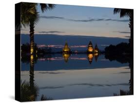 Stupas illuminated at night near infinity pool of Aureum Palace Hotel, Bagan, Mandalay Region, M...-null-Stretched Canvas