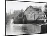 Stylish Woman Well Wrapped up for a Cold Day Stops to Admire Castle Mill Dorking Surrey England-null-Mounted Art Print