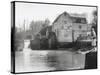 Stylish Woman Well Wrapped up for a Cold Day Stops to Admire Castle Mill Dorking Surrey England-null-Stretched Canvas