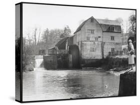 Stylish Woman Well Wrapped up for a Cold Day Stops to Admire Castle Mill Dorking Surrey England-null-Stretched Canvas