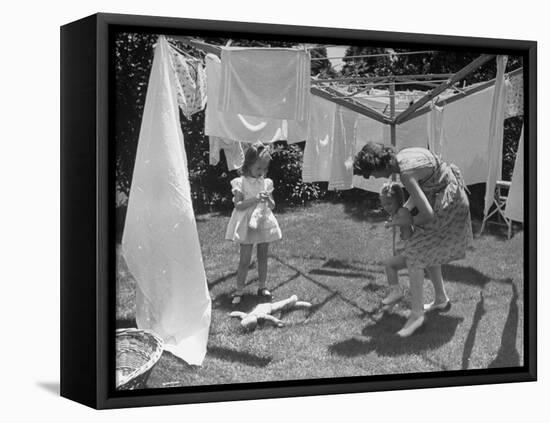 Suburban Mother Playing with Her Two Daughters While Hanging Laundry in Backyard-Alfred Eisenstaedt-Framed Stretched Canvas