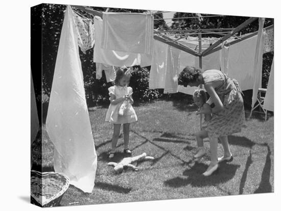 Suburban Mother Playing with Her Two Daughters While Hanging Laundry in Backyard-Alfred Eisenstaedt-Stretched Canvas