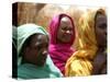 Sudanese Refugees Stand Near Their Huts-null-Stretched Canvas