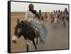 Sudanese Women Ride Donkeys at the Entrance of the Zamzam Refugee Camp-null-Framed Stretched Canvas