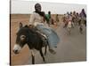 Sudanese Women Ride Donkeys at the Entrance of the Zamzam Refugee Camp-null-Stretched Canvas