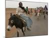 Sudanese Women Ride Donkeys at the Entrance of the Zamzam Refugee Camp-null-Mounted Photographic Print