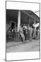 Suiting Up for Baseball at the Gasoline Station-Dorothea Lange-Mounted Art Print