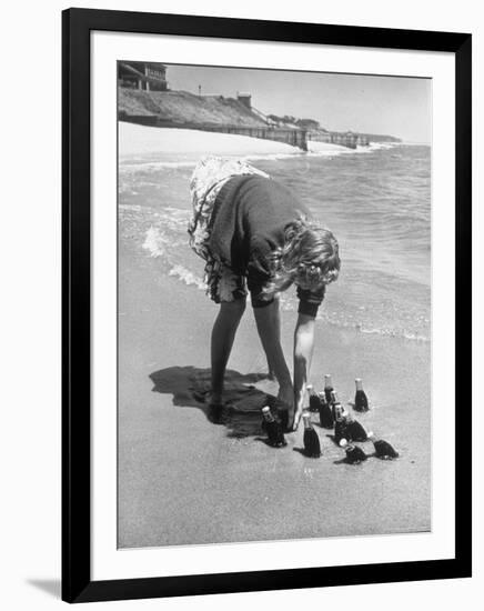 Summer at Cape Cod: Bottles of Coca Cola Buried in the Surf to Keep Them Cool-Alfred Eisenstaedt-Framed Photographic Print