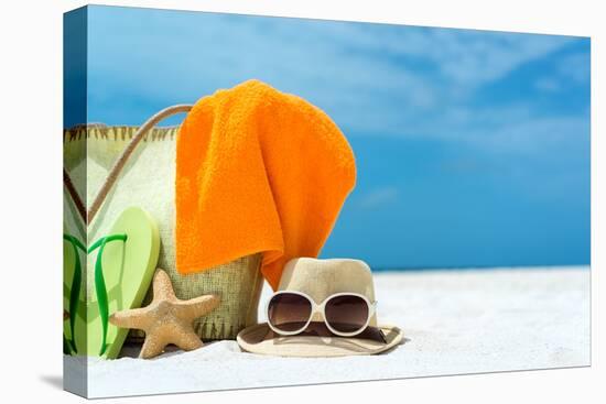 Summer Beach Bag with Coral,Towel and Flip Flops on Sandy Beach-oleggawriloff-Stretched Canvas