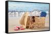 Summer Beach Bag with Straw Hat,Towel,Sunglasses and Flip Flops on Sandy Beach-Liang Zhang-Framed Stretched Canvas