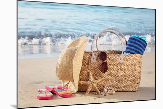 Summer Beach Bag with Straw Hat,Towel,Sunglasses and Flip Flops on Sandy Beach-Liang Zhang-Mounted Photographic Print