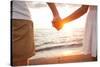 Summer Couple Holding Hands at Sunset on Beach. Romantic Young Couple Enjoying Sun, Sunshine, Roman-Maridav-Stretched Canvas