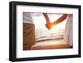 Summer Couple Holding Hands at Sunset on Beach. Romantic Young Couple Enjoying Sun, Sunshine, Roman-Maridav-Framed Photographic Print