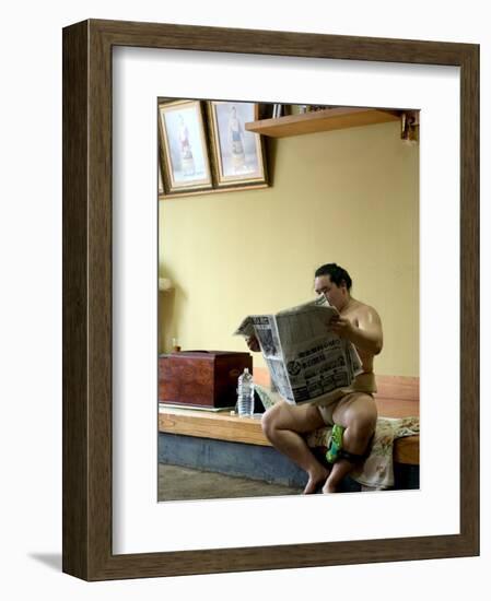 Sumo Wrestler Reading Newspaper, Tokyo City, Honshu Island, Japan-Christian Kober-Framed Photographic Print