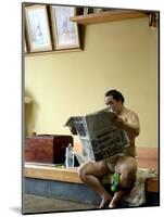 Sumo Wrestler Reading Newspaper, Tokyo City, Honshu Island, Japan-Christian Kober-Mounted Photographic Print