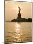Sun Setting Behind the Statue of Liberty on a Summer Evening-John Nordell-Mounted Photographic Print