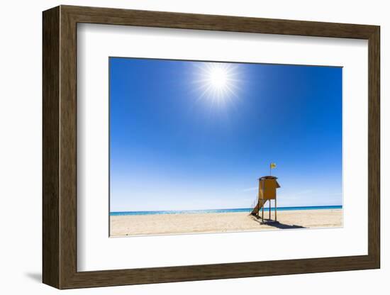 Sun shining over the lifeguard's cabin by the ocean, Morro Jable, Fuerteventura-Roberto Moiola-Framed Photographic Print