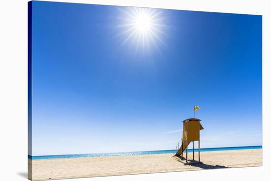 Sun shining over the lifeguard's cabin by the ocean, Morro Jable, Fuerteventura-Roberto Moiola-Stretched Canvas