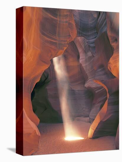 Sunbeam Illuminates Sandy Floor and Sandstone Walls of a Slot Canyon, Antelope Canyon, Page-Dennis Flaherty-Stretched Canvas