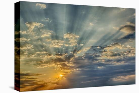 Sunbeams streaming through clouds at sunset, Cincinnati, Ohio-Adam Jones-Stretched Canvas